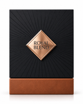 Royal Blend perfume black sunburst box with copper diamond emblem on white background