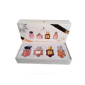 Original fragrance bottle and packaging on neat square photo